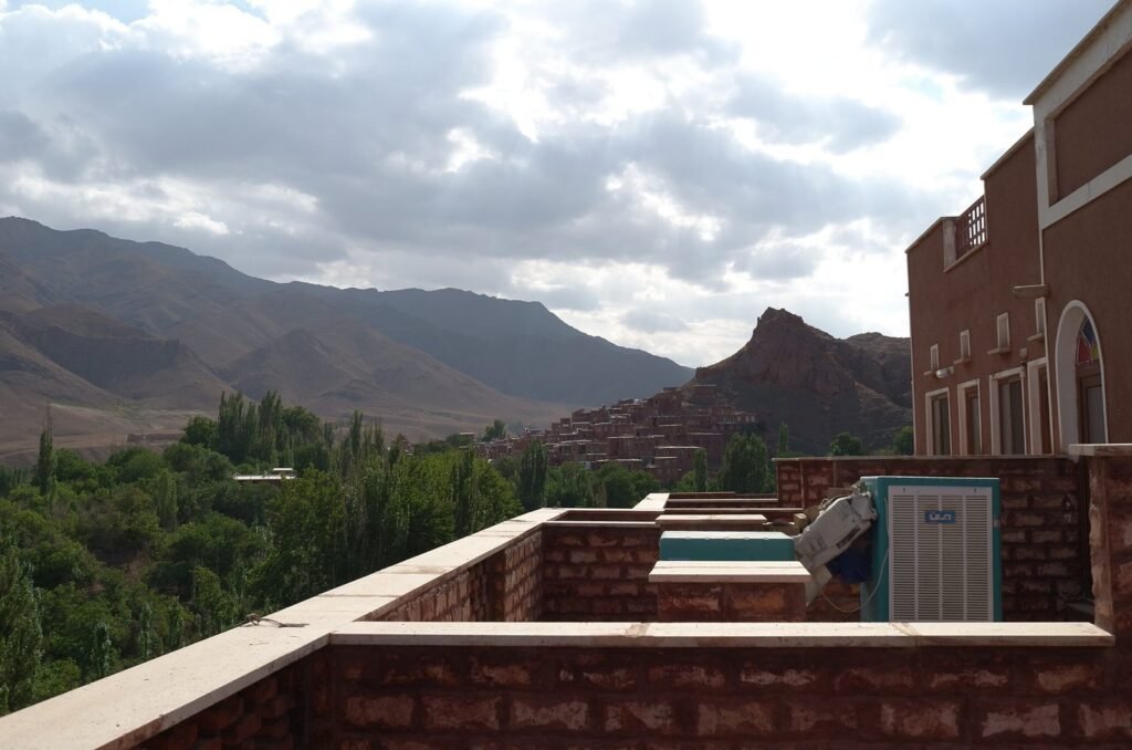 View from a hotel terrace over the green valley and mountains near Abyaneh