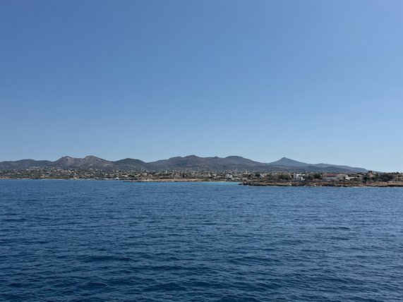Coast with houses and mountains near Aegina, seen from the sea