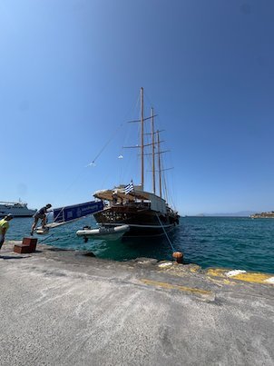 Wooden three-mast sailing ship at the quay in Aegina harbor