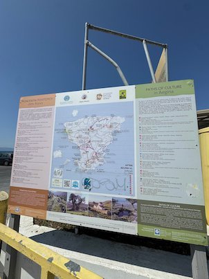 Information board with a map of Aegina island at the harbor