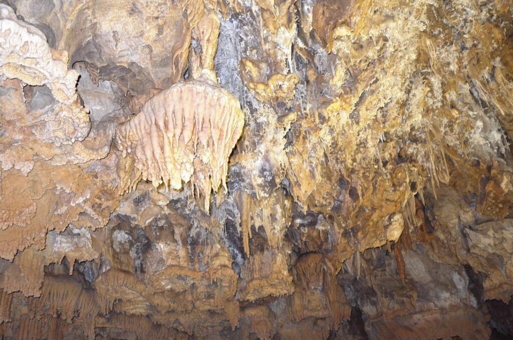 Stalactites and colored rock in Ali Sadr Cave