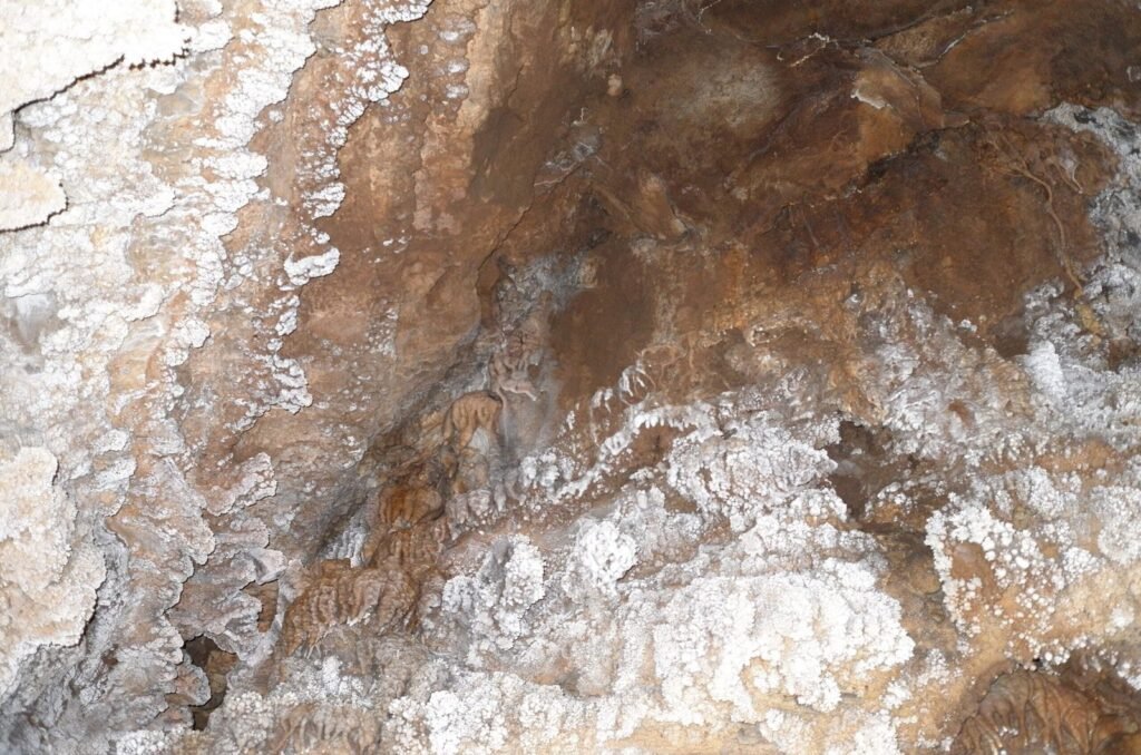 White and brown rock formations in Ali Sadr Cave