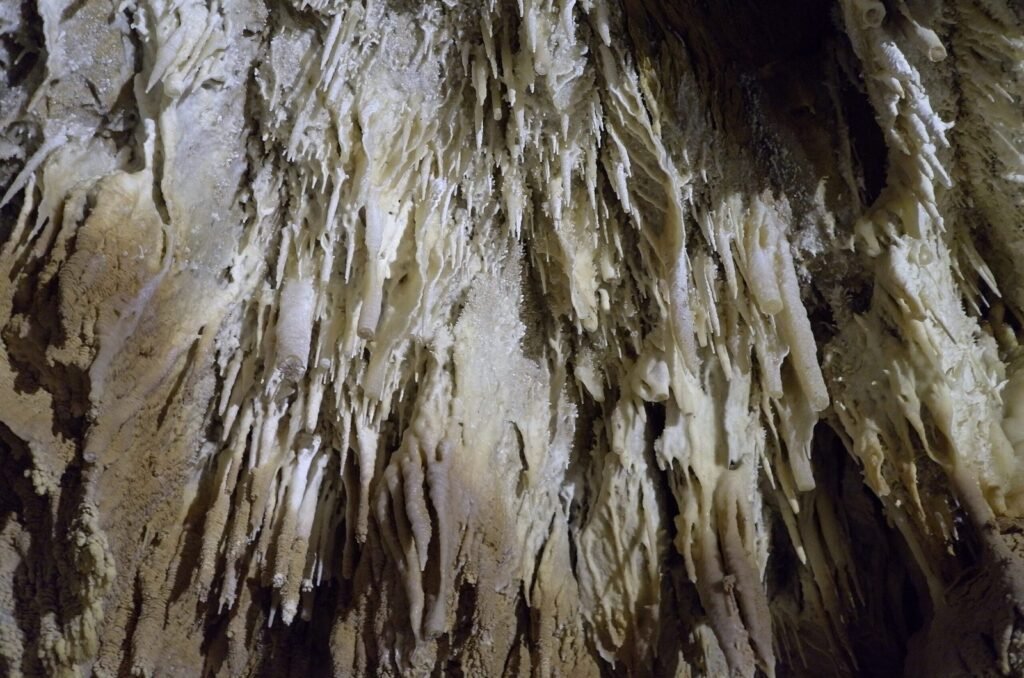 Thin stalactites in close view in Ali Sadr Cave