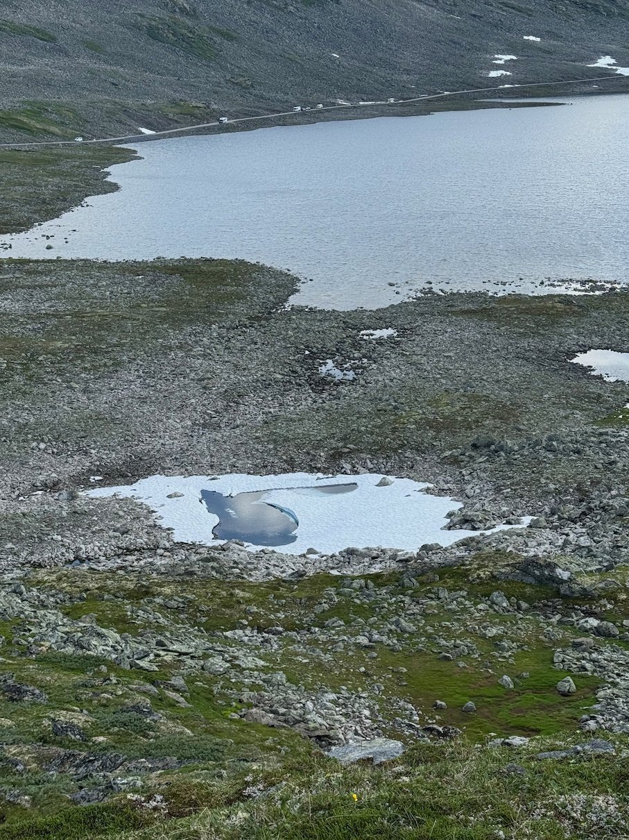 Mountain lake with melting ice on the high plateau