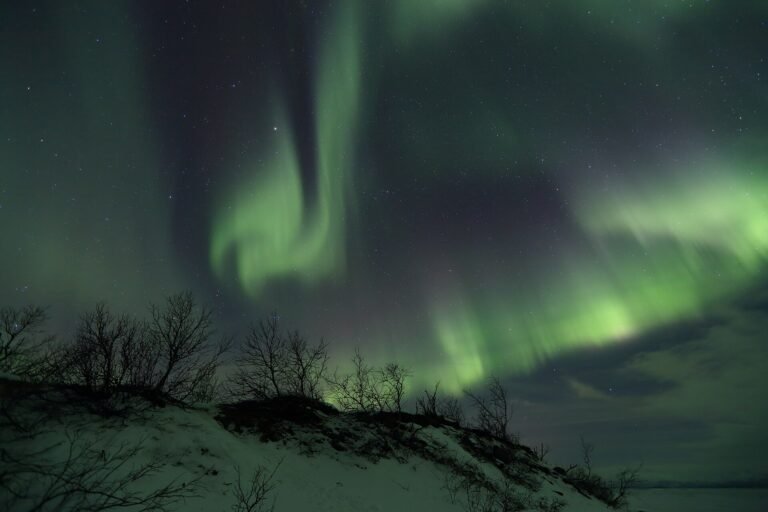 Green northern lights over Abisko near Lake Torneträsk in Swedish Lapland