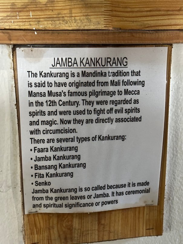 A sign explains the Jamba Kankurang tradition of the Mandinka in the Kachikally museum, Bakau.
