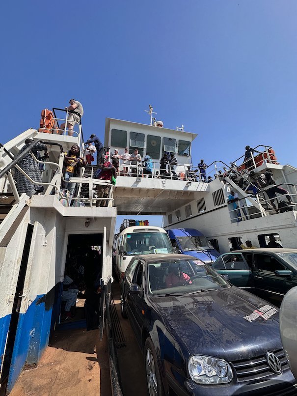 Cars stand on the deck of the crowded ferry between Barra and Banjul, The Gambia.