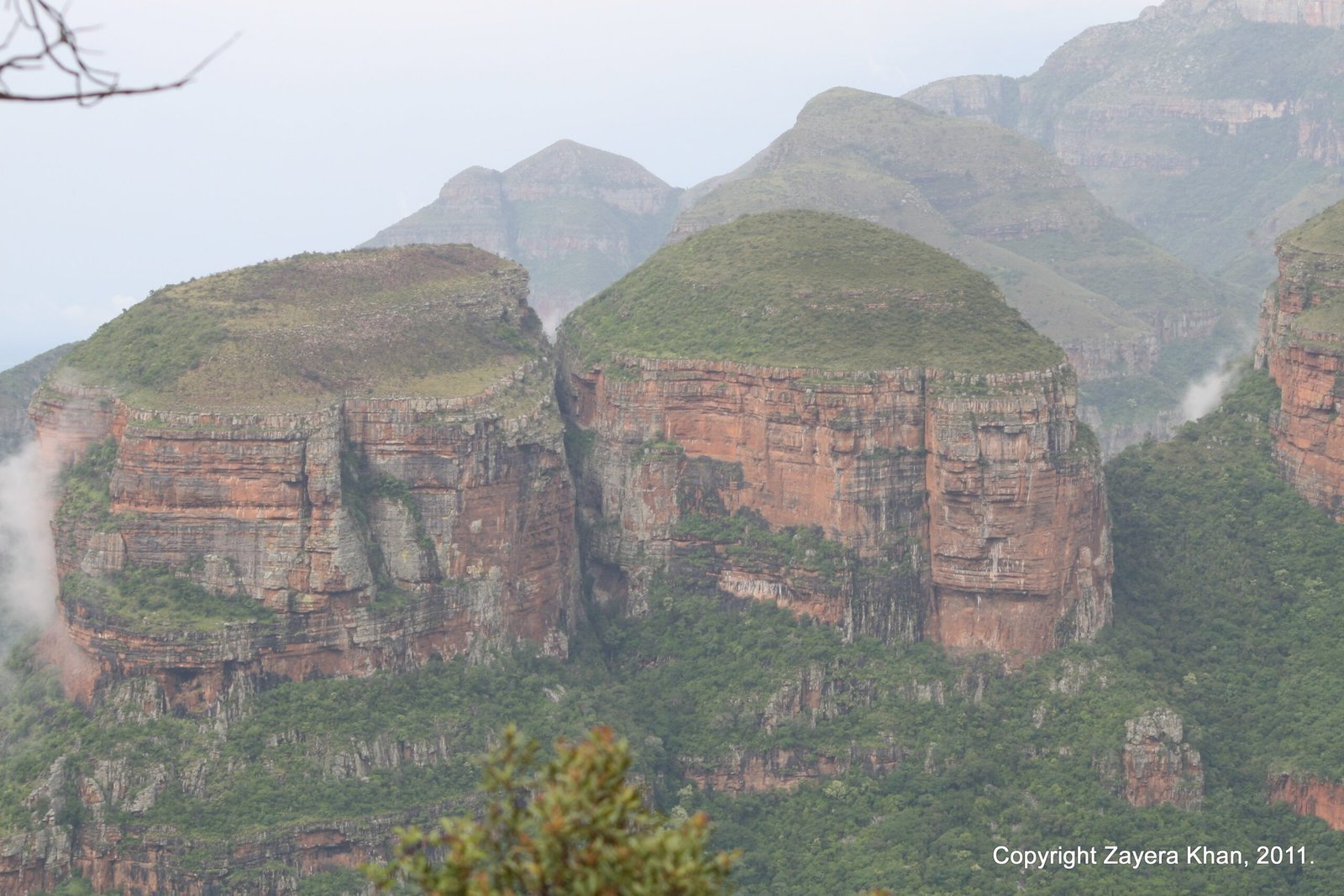 The Three Rondavels rise above the green Blyde River Canyon in Mpumalanga, South Africa.