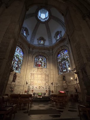A chapel with stained glass and a small dome is part of the cathedral in Brussels.