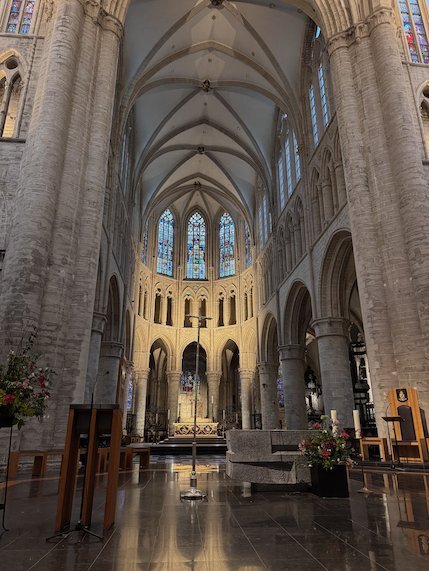 The bright choir of the Cathedral of St. Michael and St. Gudula rises behind the nave.