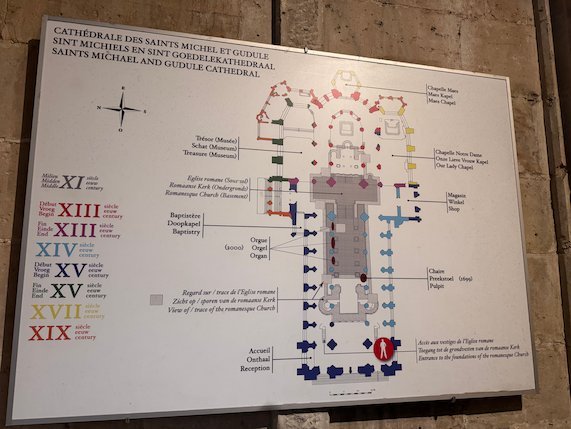A sign shows the floor plan and building dates of the Cathedral of St. Michael and St. Gudula.