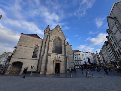 The stone Church of Saint Nicholas stands on a small square in central Brussels.