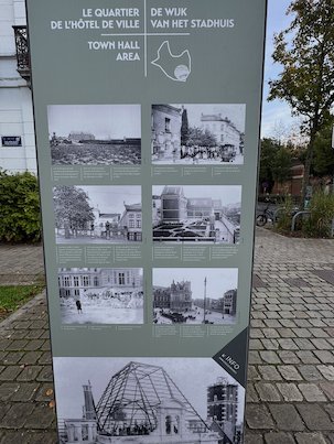 An information pillar shows old photos of the town hall area in Saint-Gilles.