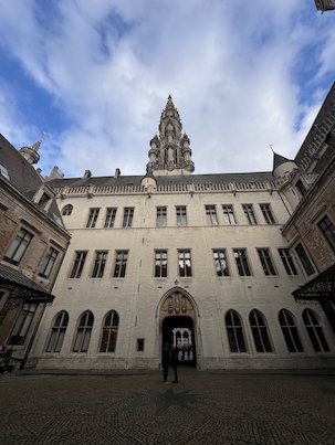 The inner courtyard of the Town Hall has a tall tower above it in Brussels.