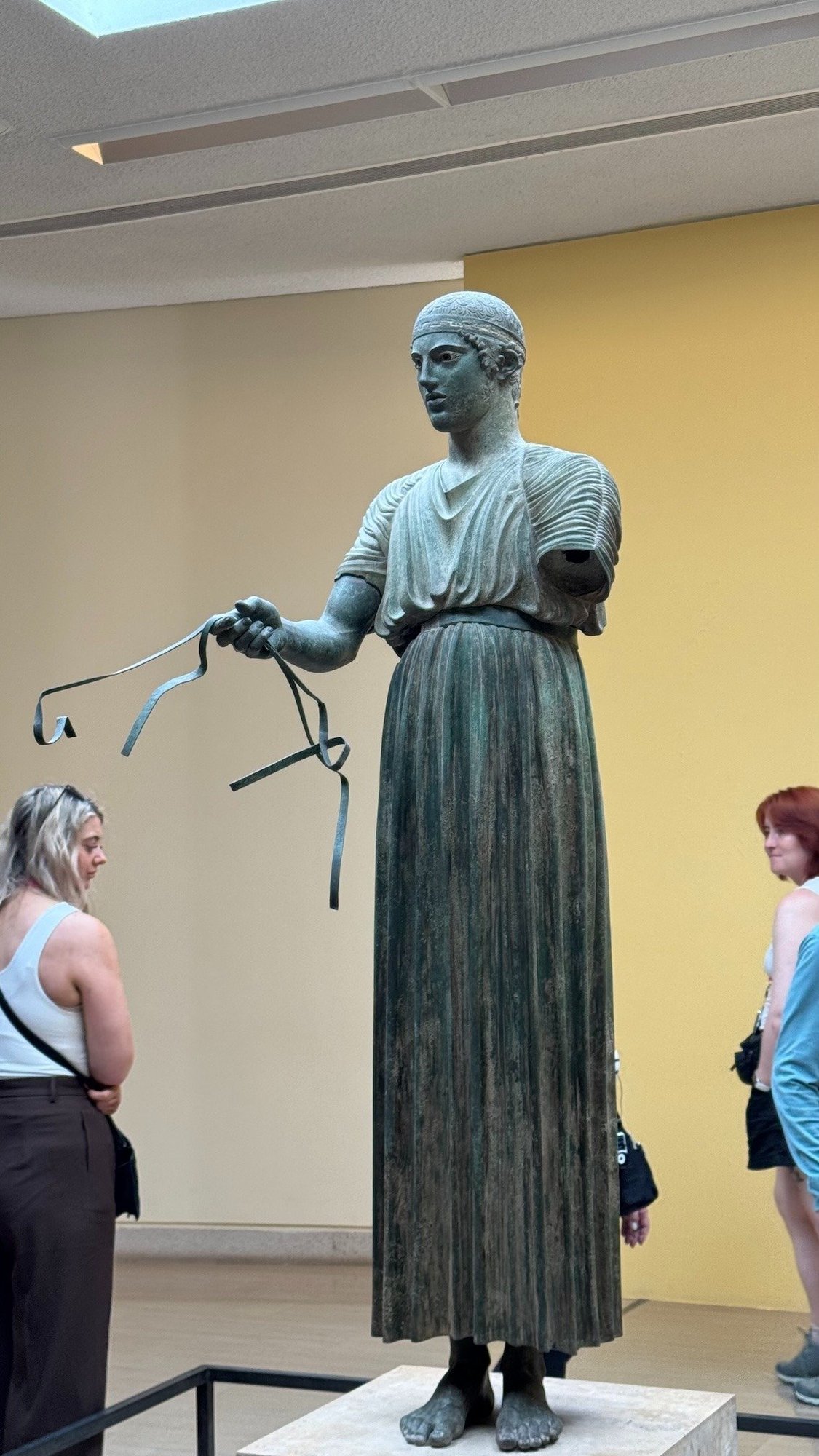 Bronze statue of the Charioteer of Delphi in the Delphi Archaeological Museum