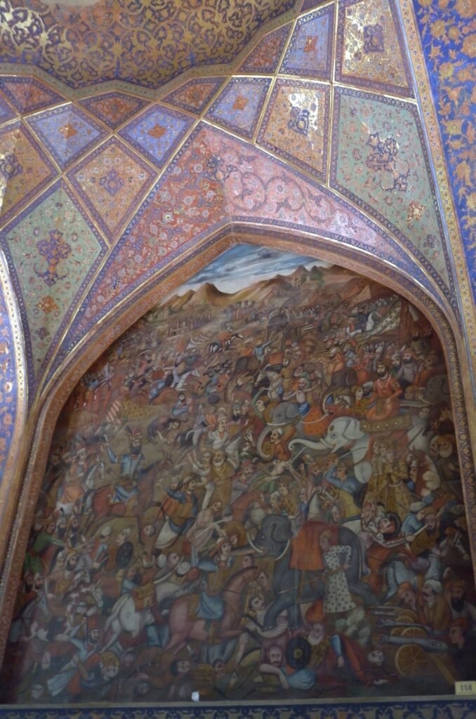 Wall painting of a battle under a painted arch in Chehel Sotoun Palace