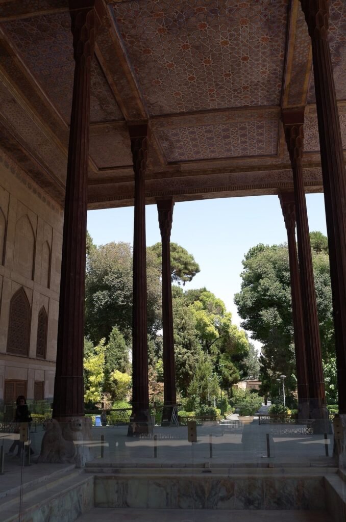 Tall wooden columns of the porch at Chehel Sotoun Palace