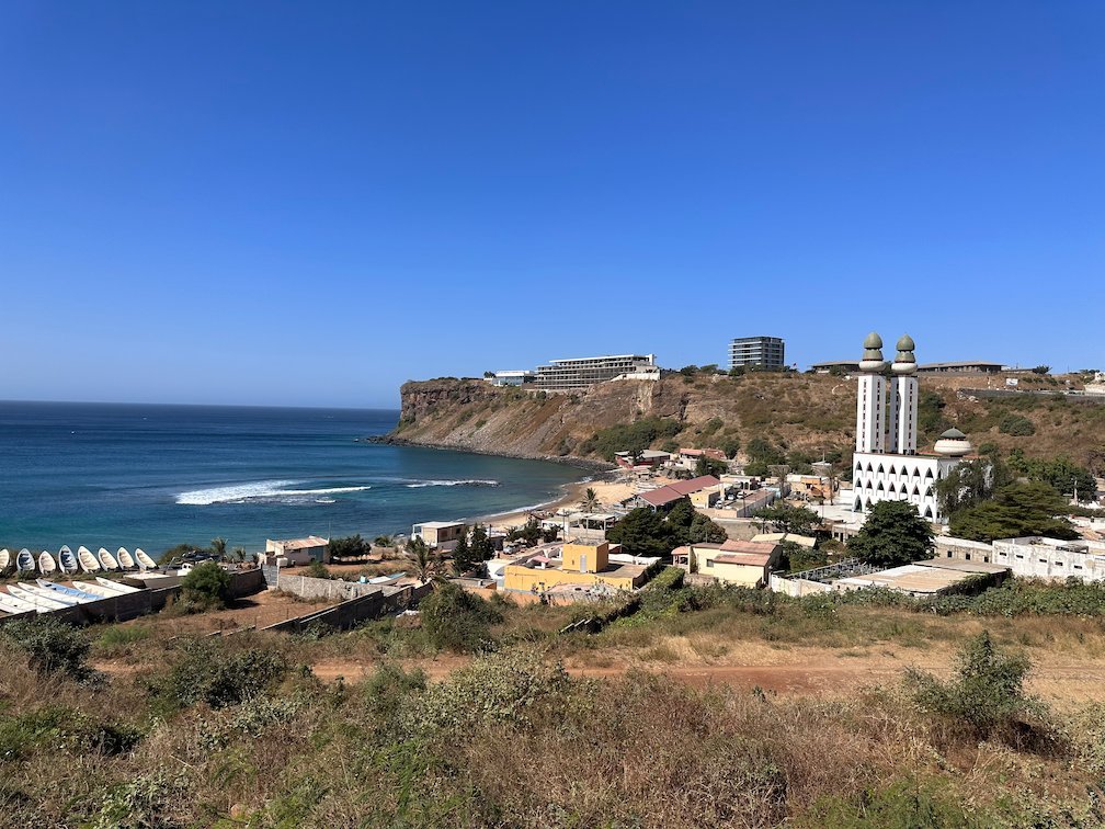 The coast of Ouakam with the mosque and a cliff in Dakar.