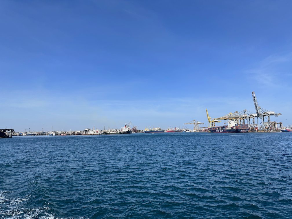 Cranes stand in the port of Dakar, seen from the ferry to Goree Island.