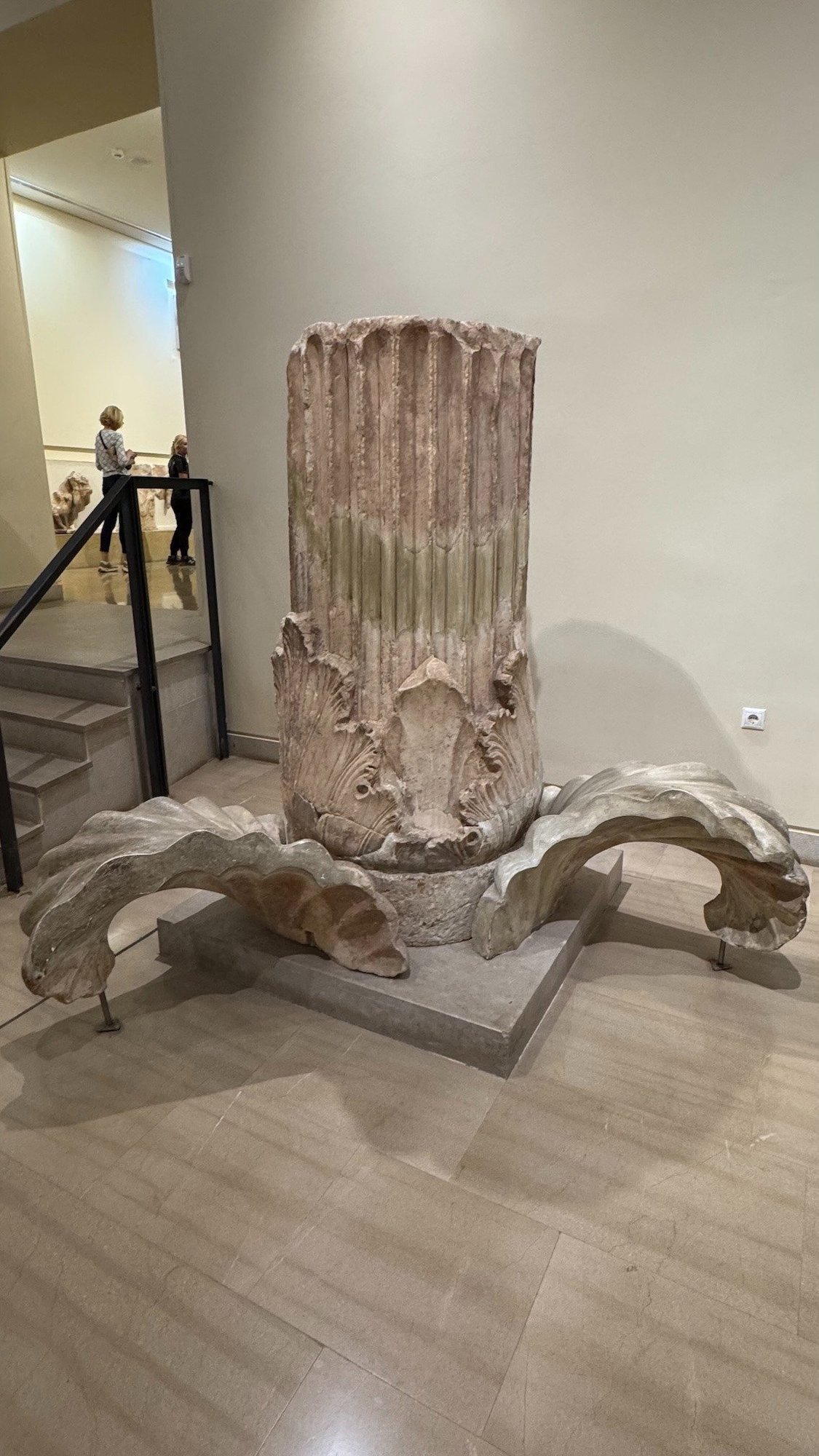 Marble base of the Acanthus Column with carved leaves in the Delphi Archaeological Museum