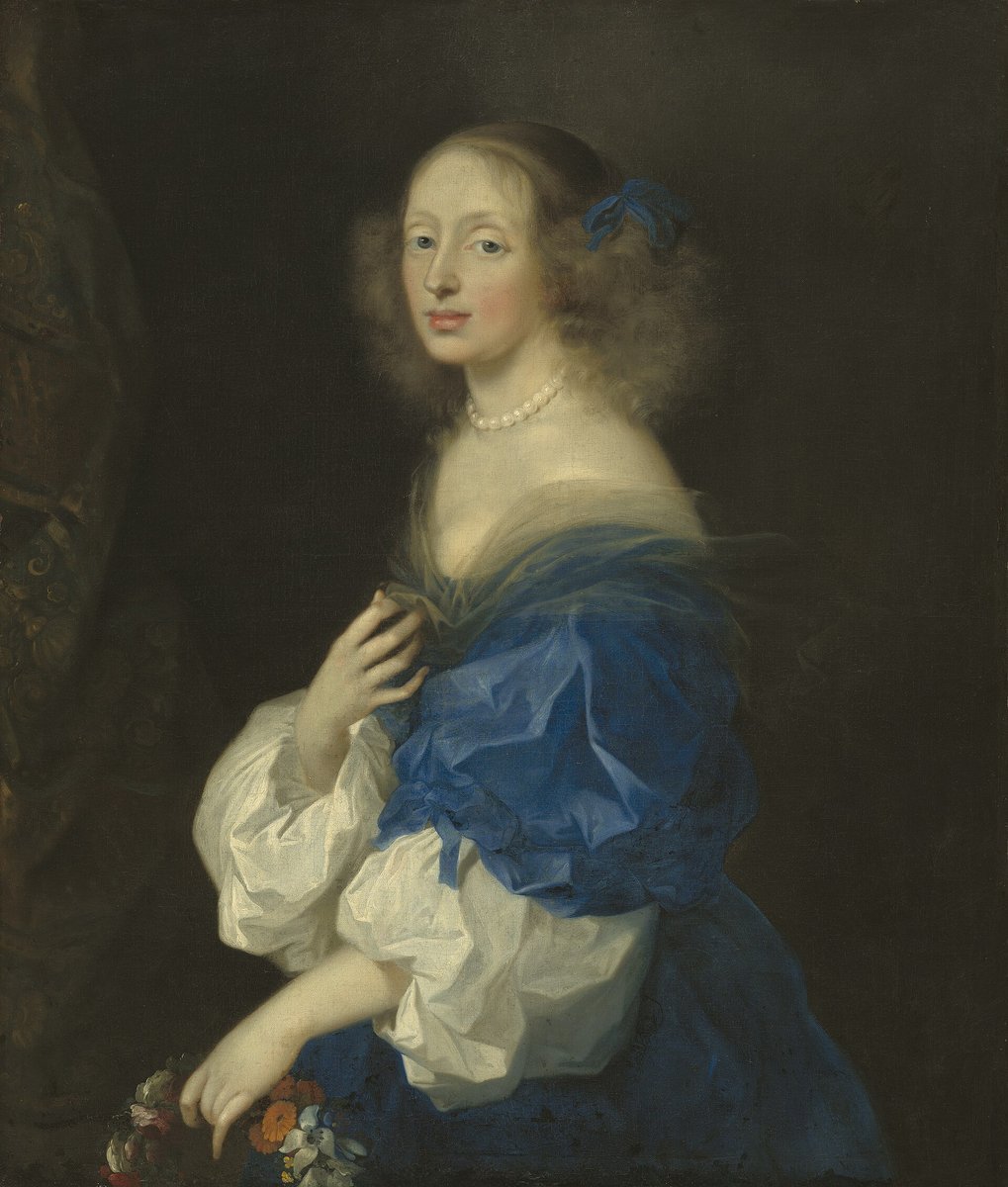 Portrait of Ebba Sparre with light brown curls, a blue ribbon in her hair, pearls and a blue and white silk dress.