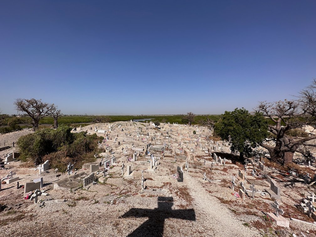 Graves and baobab trees cover the shell island cemetery of Fadiouth.