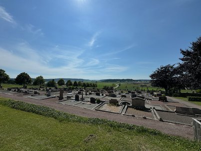 Graveyard at Fjärås church with old family graves and a wide view over the Halland countryside
