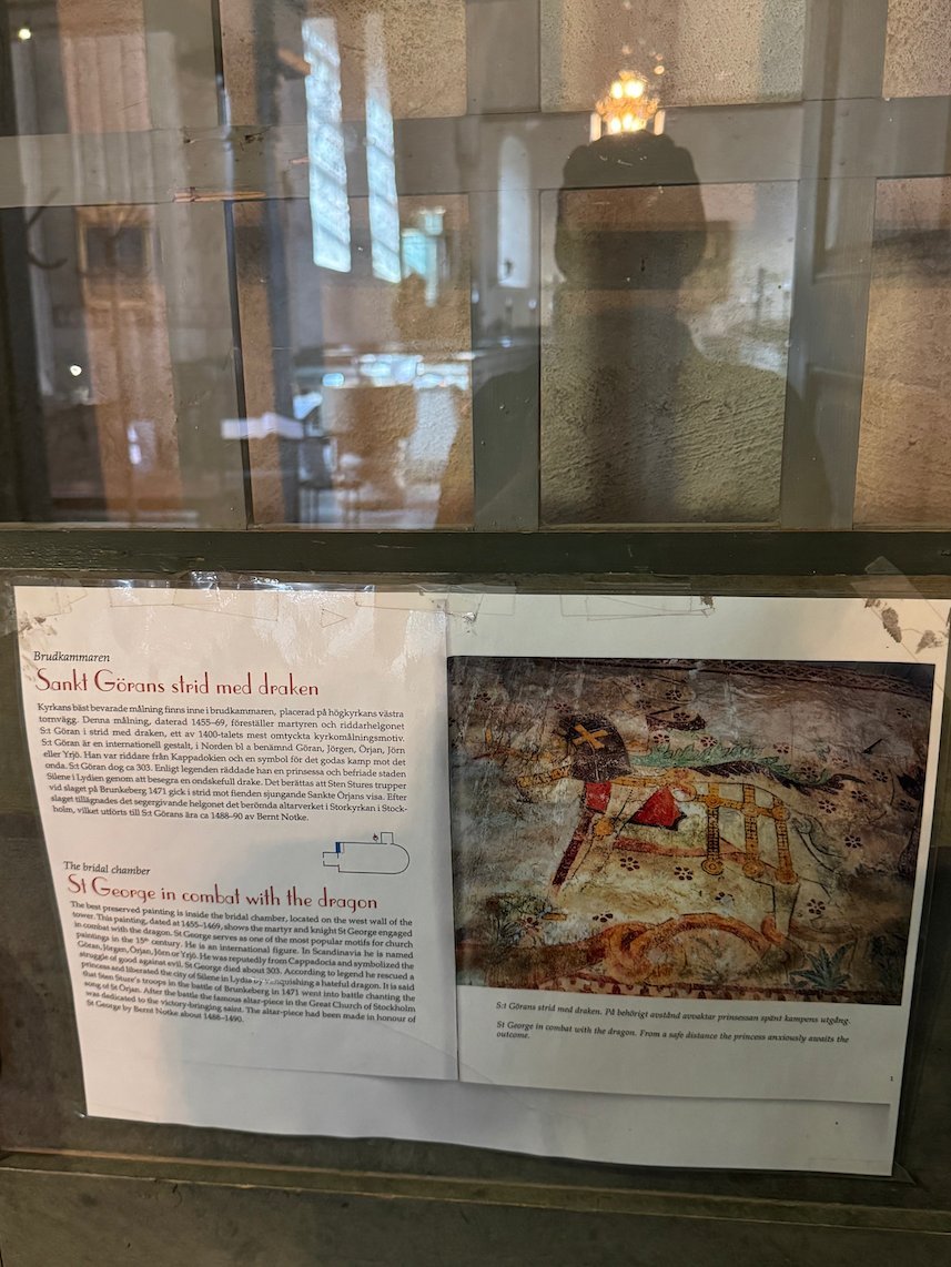 Display case with information about a medieval wall painting in Gamla Uppsala church