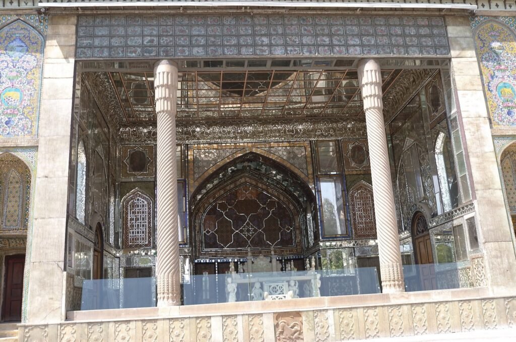 Open hall of the Marble Throne at Golestan Palace with columns and mirror work