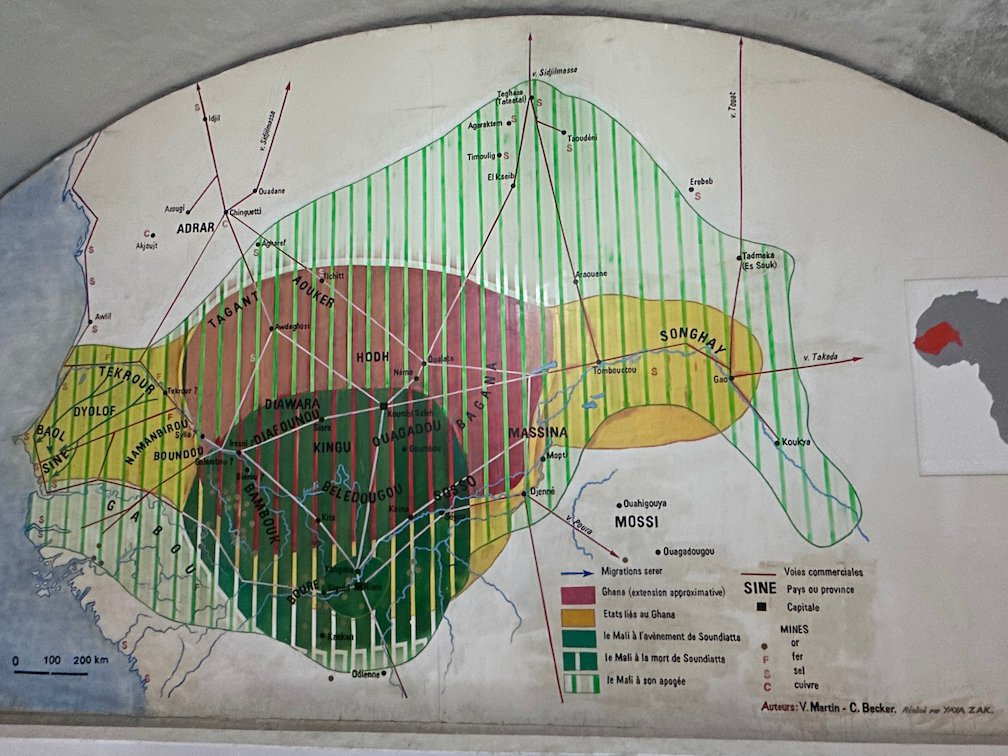 A painted wall map shows old empires of West Africa in a Goree Island museum.