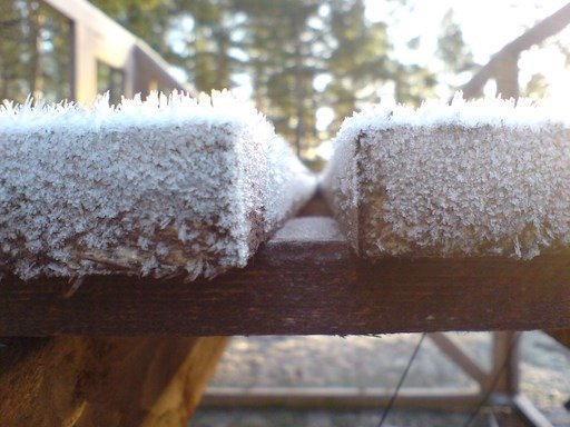Thick frost covers the wooden boards of a railing on Kadermo island near Hanko.