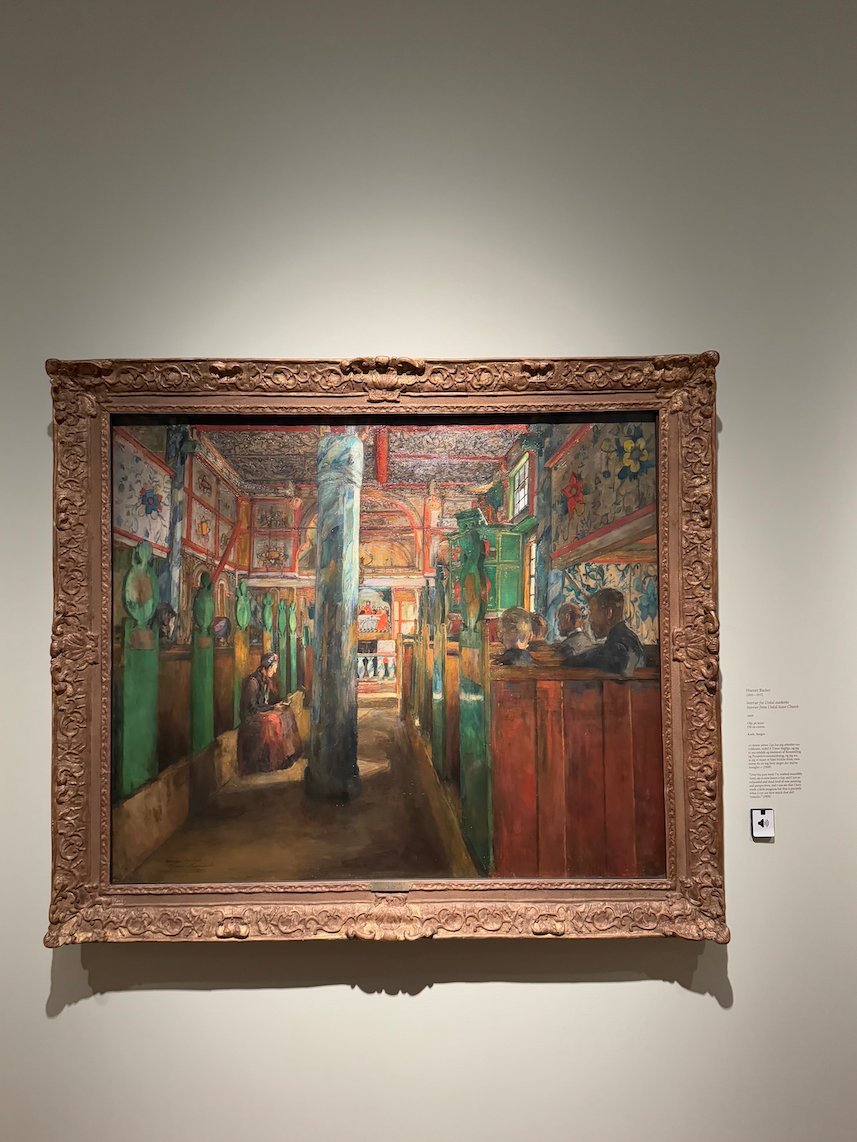 Painting by Harriet Backer of a richly painted church interior with green pews