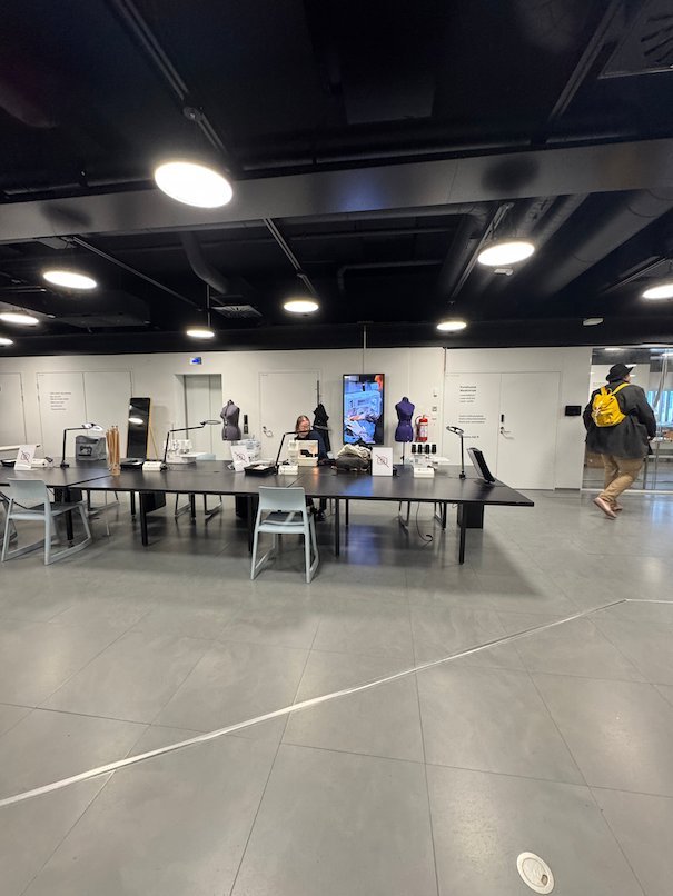 Large work tables and sewing stations fill the Urban Workshop on the second floor of Oodi in Helsinki.