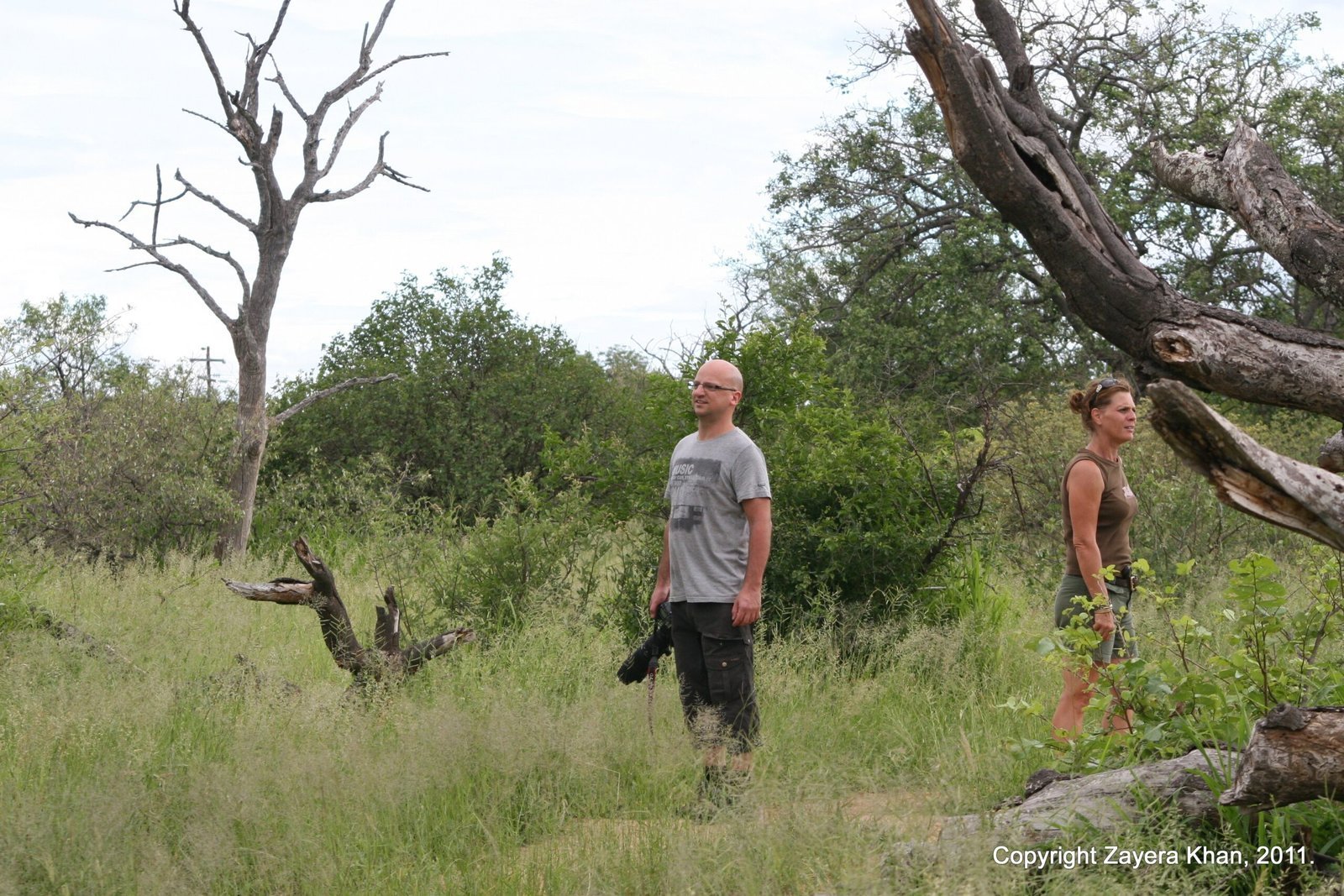 Two students stand in the grass during a bush walk near Hoedspruit.