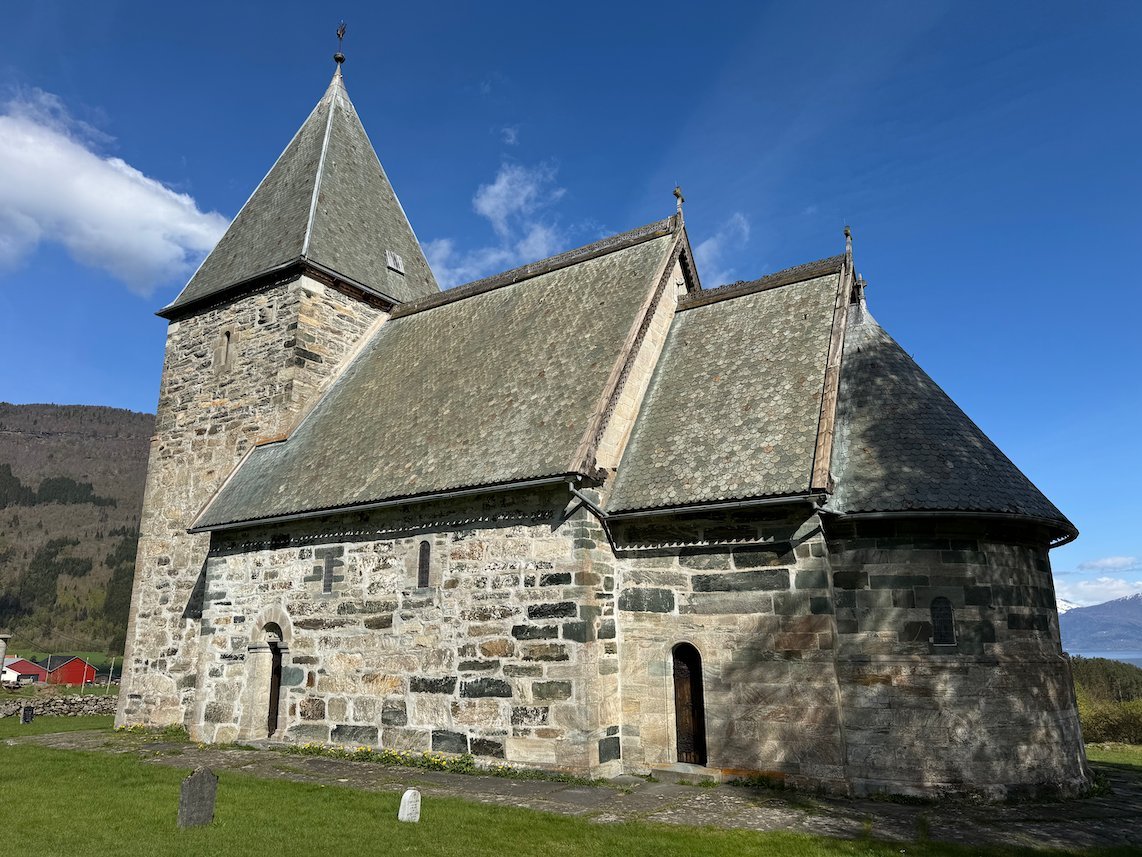 Hove stone church from around 1170 in Vik, with a slate roof and a short tower