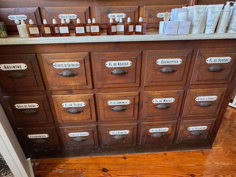Wooden drawers with old labels inside the old pharmacy in Hydra