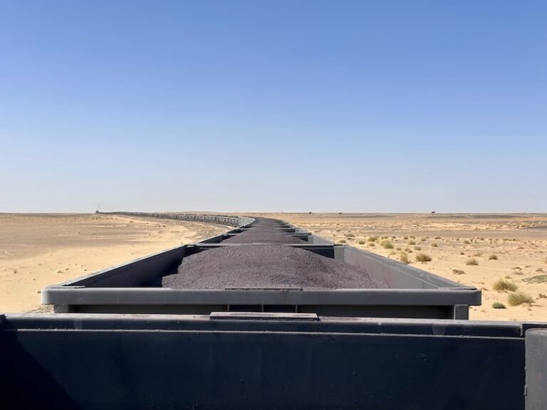 The long iron ore train curves through the Sahara desert in Mauritania.