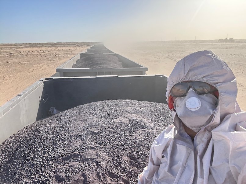Zayera Khan takes a selfie in a protective suit on top of the long ore train.