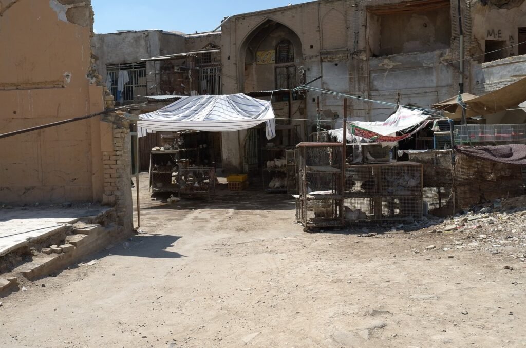 Market stalls in front of an old building in Isfahan