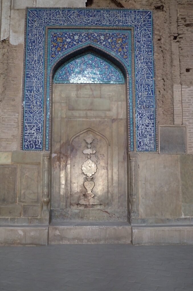 Tiled mihrab with carved stone in the Jameh Mosque of Isfahan