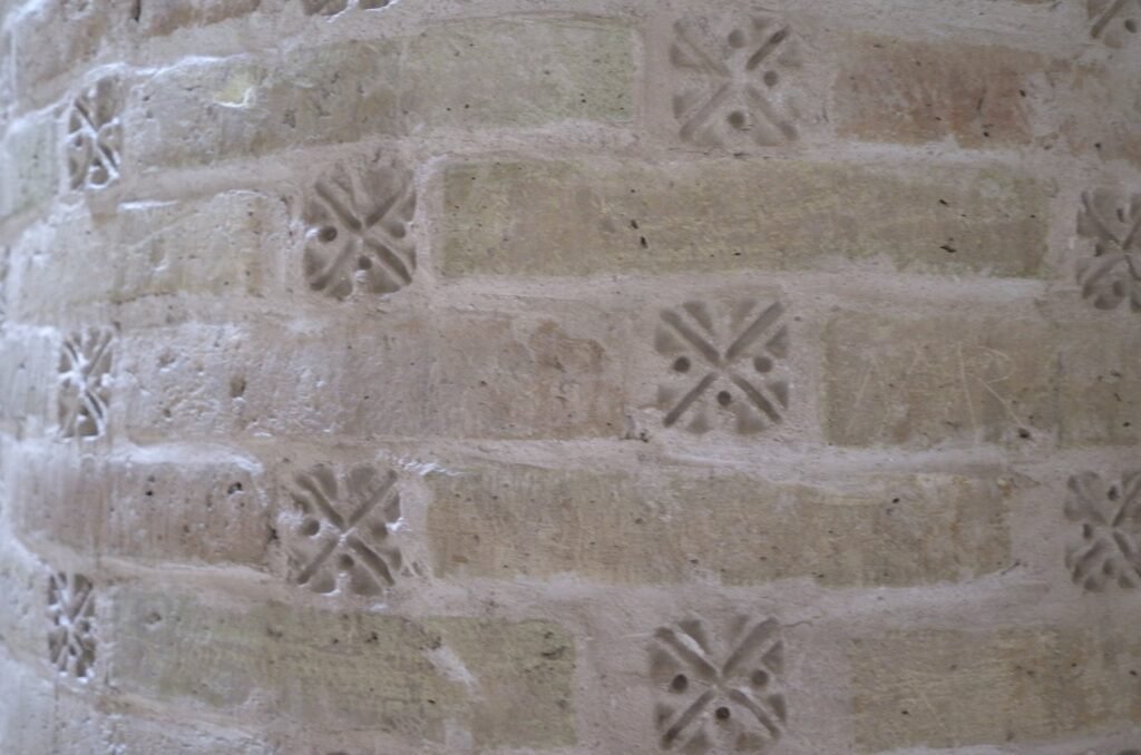 Brick column with carved patterns in the Jameh Mosque of Isfahan