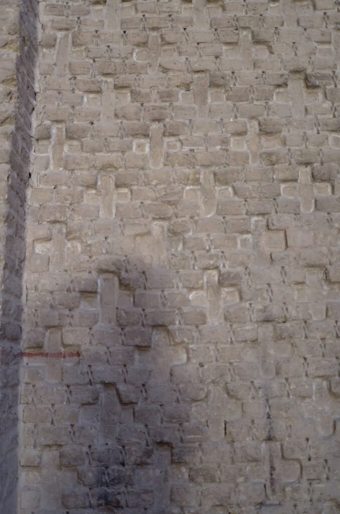 Brick wall with a cross pattern in the Jameh Mosque of Isfahan