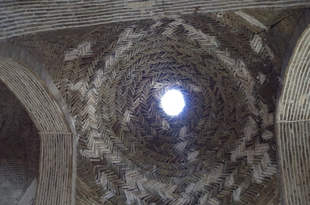 Brick vault with a round opening in the Jameh Mosque of Isfahan