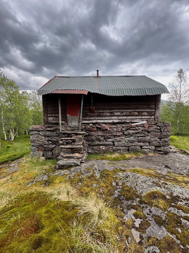 Old log cabin on a rock at Kvanndalsstølen