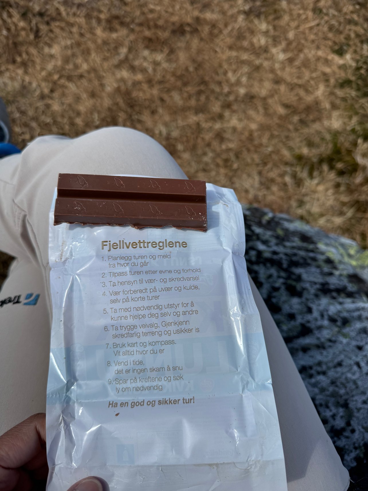 Kvikk Lunsj wrapper with Fjellvettreglene, the Norwegian mountain code, printed on it
