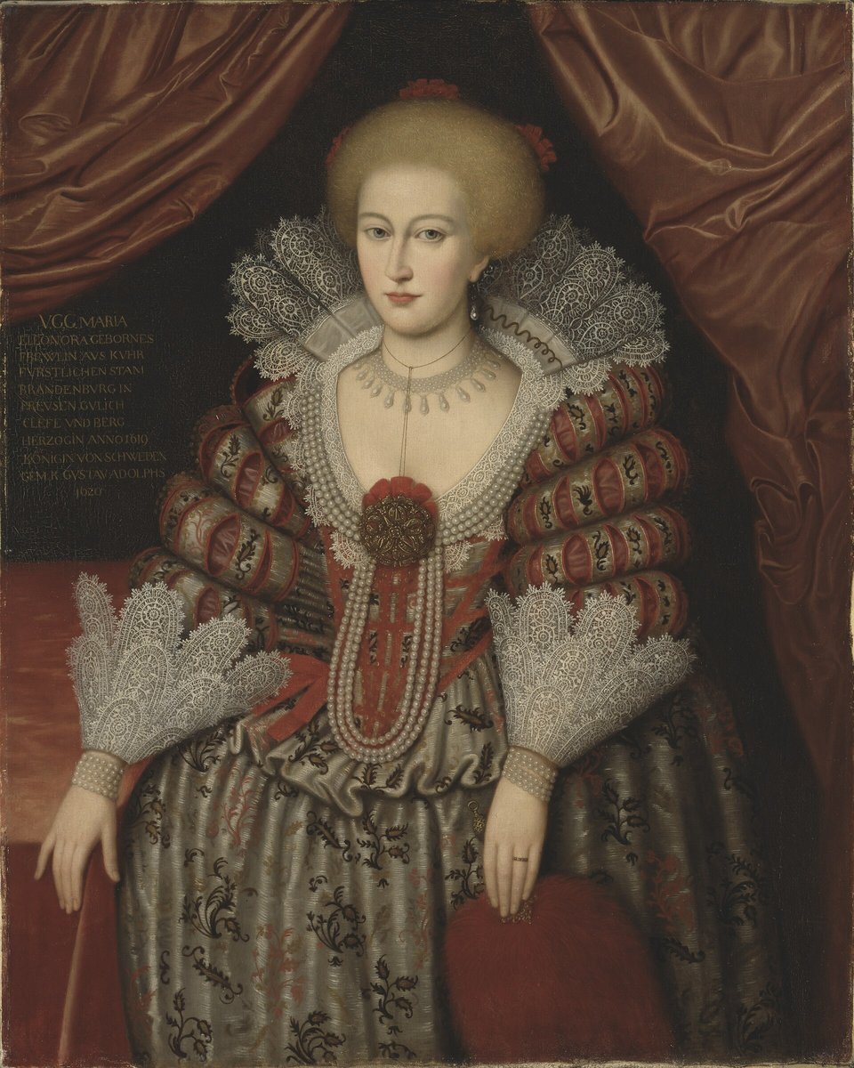 Portrait of Queen Maria Eleonora of Brandenburg, Kristina's mother, with a wide lace collar, long strings of pearls and a red and gold dress.