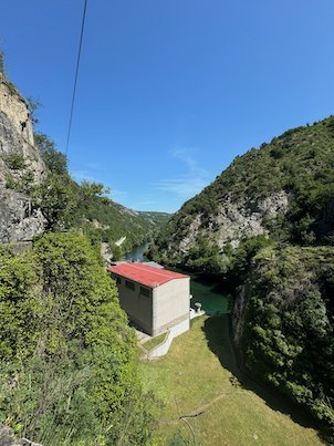 A building with a red roof stands above the gorge in Matka Canyon near Skopje.