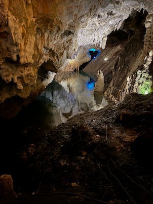 Blue lights shine on rock formations inside Vrelo Cave at Matka near Skopje.