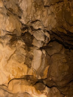 Pale flowstone covers a rock wall inside Vrelo Cave at Matka near Skopje.