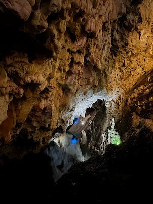 Stalactites hang above a lit passage inside Vrelo Cave at Matka near Skopje.
